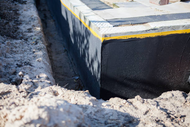 Professional Basement Waterproofing technician working in Church Hill, PA